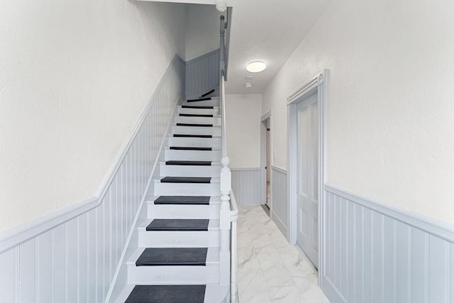 339-341 Norfolk St, Cambridge, MA 02139 - staircase with wainscoting and marble look tiles