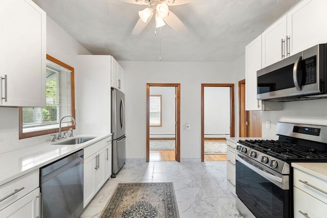 339-341 Norfolk St, Cambridge, MA 02139 - kitchen featuring appliances with stainless steel finishes, a sink, a ceiling fan, light countertops, and white cabinetry