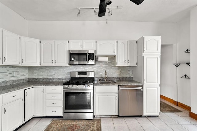 339-341 Norfolk St, Cambridge, MA 02139 - kitchen featuring stainless steel appliances, a sink, ceiling fan, light tile patterned flooring, and white cabinets