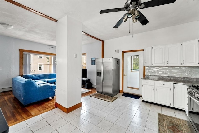 339-341 Norfolk St, Cambridge, MA 02139 - kitchen featuring appliances with stainless steel finishes, ceiling fan, baseboard heating, and backsplash