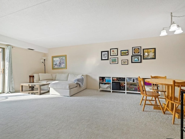 carpeted living room featuring a textured ceiling