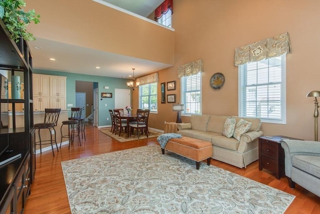 15 Herrick Dr Unit 15, Methuen, MA 01844 - living room featuring light wood finished floors, a chandelier, recessed lighting, and baseboards