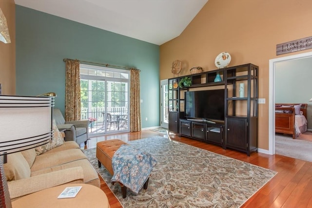 15 Herrick Dr Unit 15, Methuen, MA 01844 - living room featuring wood finished floors, baseboards, and high vaulted ceiling