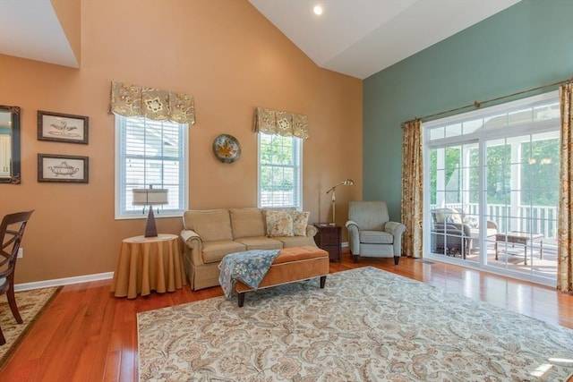 15 Herrick Dr Unit 15, Methuen, MA 01844 - living room with high vaulted ceiling, healthy amount of natural light, wood finished floors, and baseboards