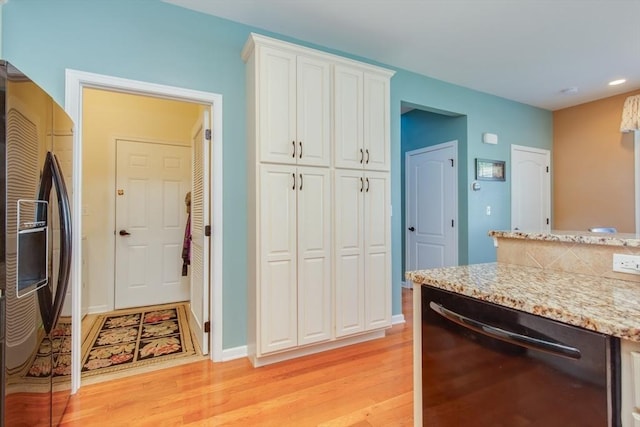 15 Herrick Dr Unit 15, Methuen, MA 01844 - kitchen featuring fridge with ice dispenser, black dishwasher, light wood-type flooring, white cabinetry, and light stone counters