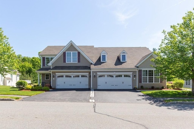 15 Herrick Dr Unit 15, Methuen, MA 01844 - view of front of house featuring asphalt driveway and a front lawn