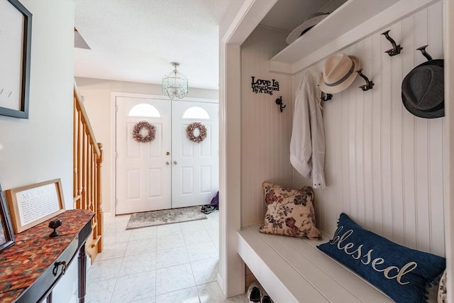 35 Dejordy Ln, Chicopee, MA 01020 - mudroom with light marble finish flooring and a chandelier