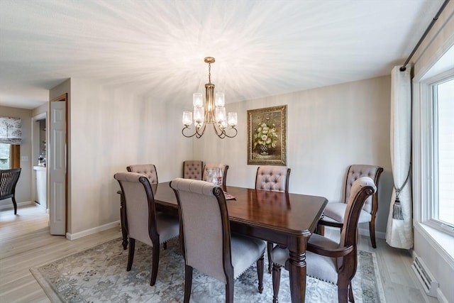 35 Dejordy Ln, Chicopee, MA 01020 - dining space featuring a chandelier, light wood-type flooring, and healthy amount of natural light