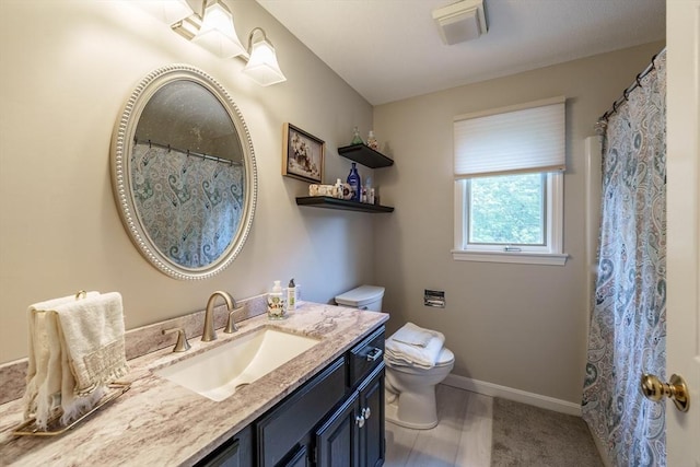35 Dejordy Ln, Chicopee, MA 01020 - bathroom with toilet, vanity, and baseboards