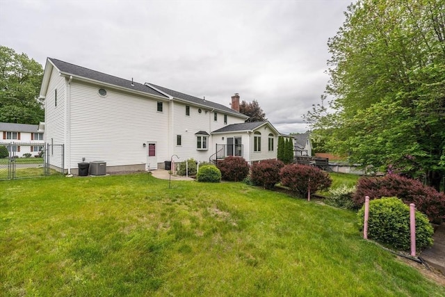 35 Dejordy Ln, Chicopee, MA 01020 - back of property with central air condition unit