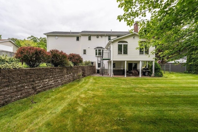 35 Dejordy Ln, Chicopee, MA 01020 - rear view of property with a patio, a chimney, stairway, and a deck