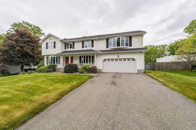 35 Dejordy Ln, Chicopee, MA 01020 - traditional-style home with an attached garage, a porch, and driveway