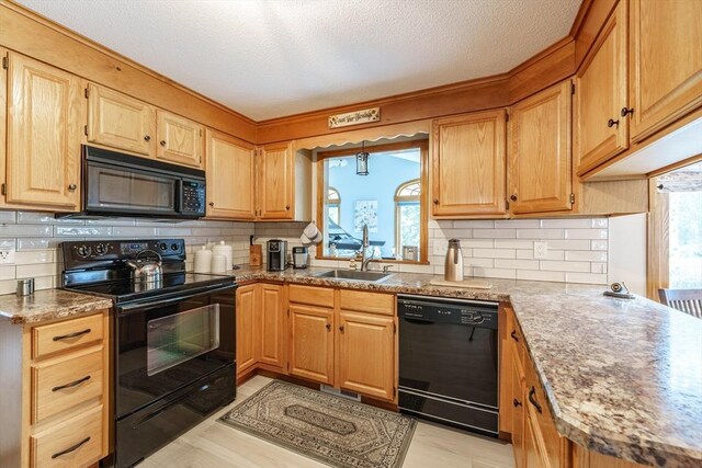 35 Dejordy Ln, Chicopee, MA 01020 - kitchen with black appliances, a sink, tasteful backsplash, and a textured ceiling