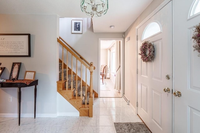 35 Dejordy Ln, Chicopee, MA 01020 - foyer entrance with light marble finish floors, a chandelier, stairway, and baseboards