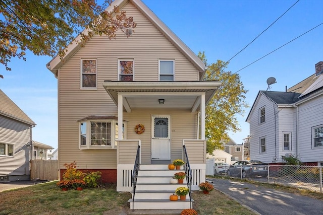 view of front of home with fence