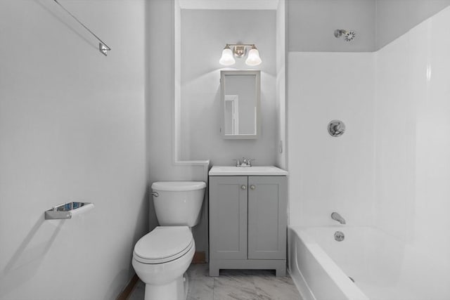 bathroom with toilet, marble finish floor, shower / washtub combination, and vanity