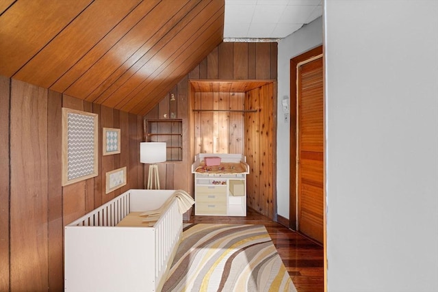 bathroom with wooden walls and wood finished floors