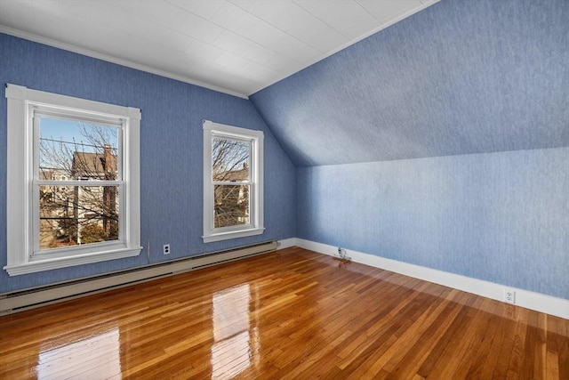 bonus room featuring baseboards, hardwood / wood-style floors, lofted ceiling, and a baseboard radiator