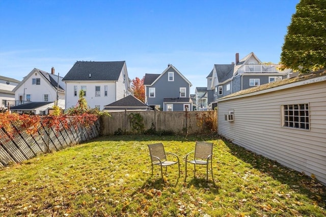 view of yard with a residential view and fence