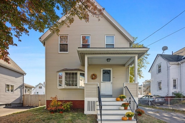 view of front of property featuring fence