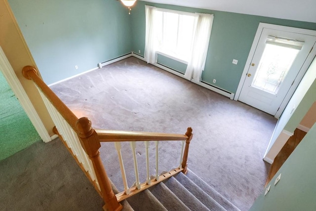 stairs with carpet, a baseboard radiator, and healthy amount of natural light