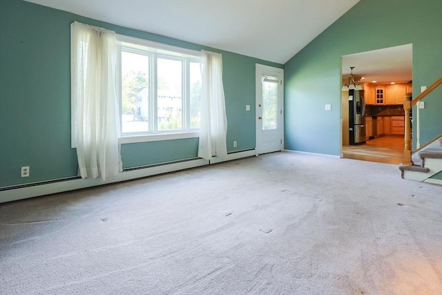 unfurnished living room with stairs, vaulted ceiling, and carpet flooring