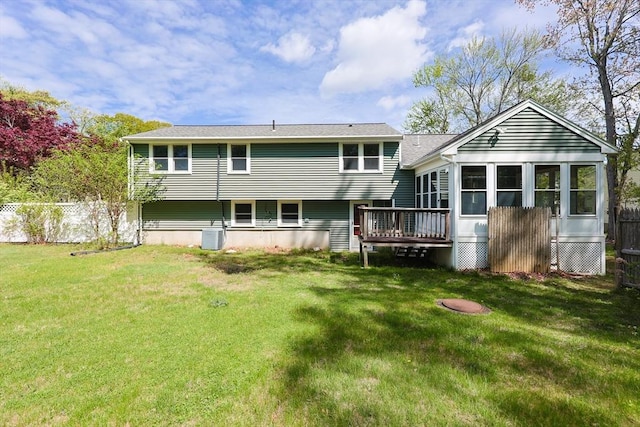 back of property with central AC and a wooden deck