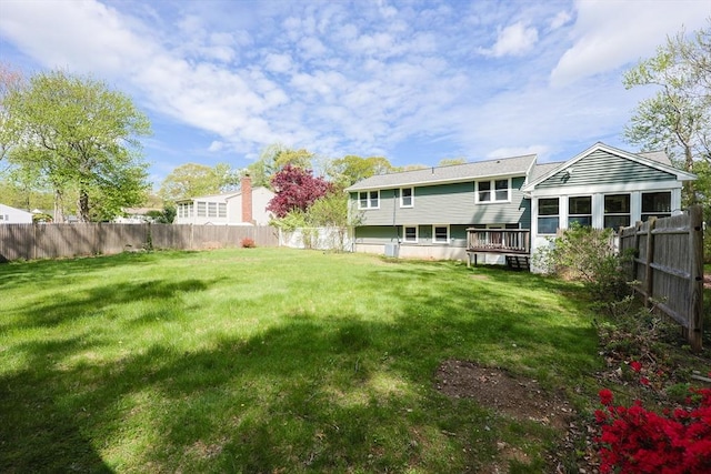 back of house with a deck