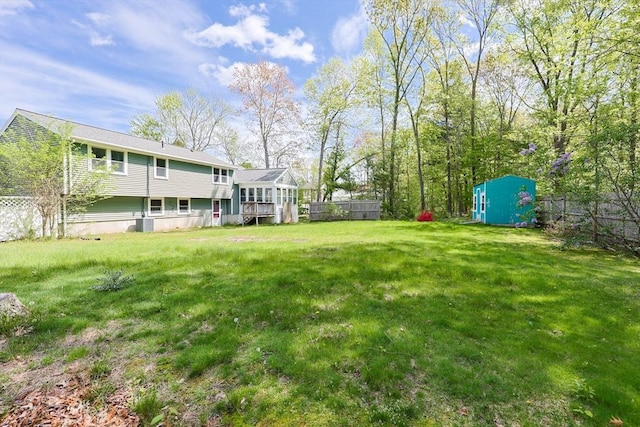 view of yard with a storage unit and an outdoor structure