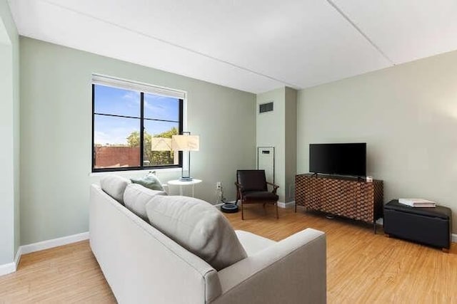 200 Ledgewood Dr Unit 604, Stoneham, MA 02180 - living area featuring light wood-style floors and baseboards