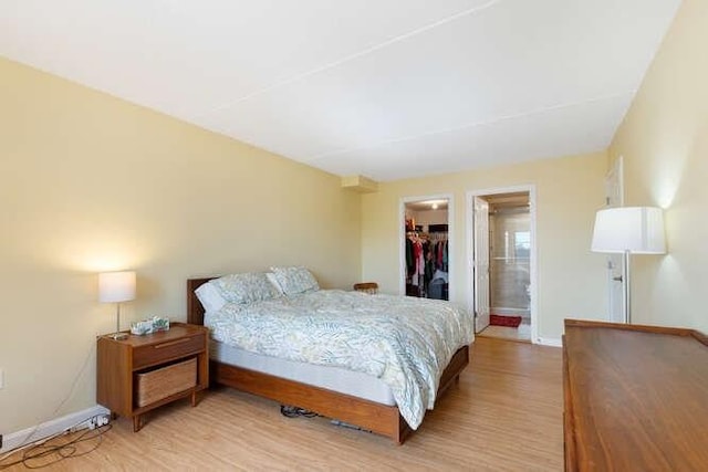 200 Ledgewood Dr Unit 604, Stoneham, MA 02180 - bedroom with light wood-style flooring, a spacious closet, and a closet