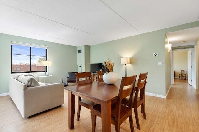 200 Ledgewood Dr Unit 604, Stoneham, MA 02180 - dining area featuring light wood-style floors