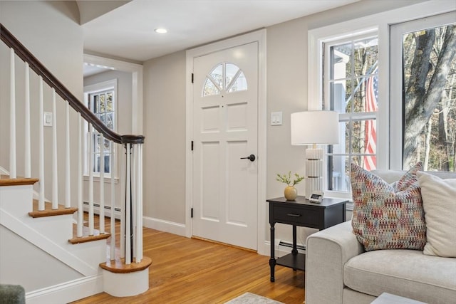 foyer featuring wood-type flooring and baseboard heating