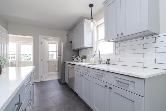 7 Dewey Ave, East Longmeadow, MA 01028 - kitchen featuring stainless steel appliances, backsplash, decorative light fixtures, and light stone counters