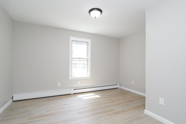7 Dewey Ave, East Longmeadow, MA 01028 - unfurnished room with a baseboard radiator and light wood-style floors