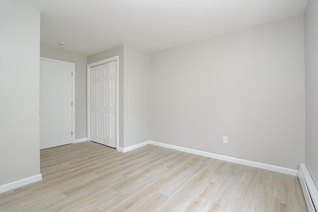 7 Dewey Ave, East Longmeadow, MA 01028 - unfurnished room with baseboard heating and light wood-type flooring