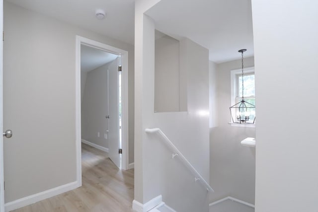 7 Dewey Ave, East Longmeadow, MA 01028 - hall featuring an upstairs landing, light wood-style flooring, and a chandelier