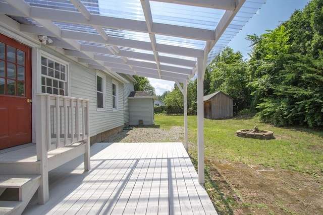 7 Dewey Ave, East Longmeadow, MA 01028 - wooden terrace with a fire pit, a yard, a shed, and a pergola