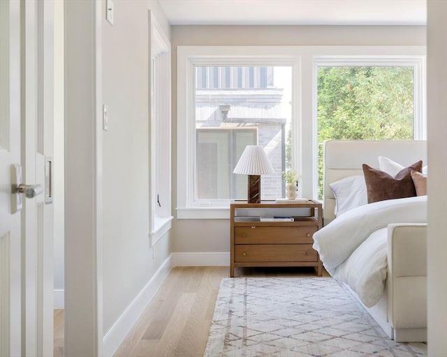 13 Mellen St, Cambridge, MA 02138 - bedroom with light wood-type flooring and baseboards