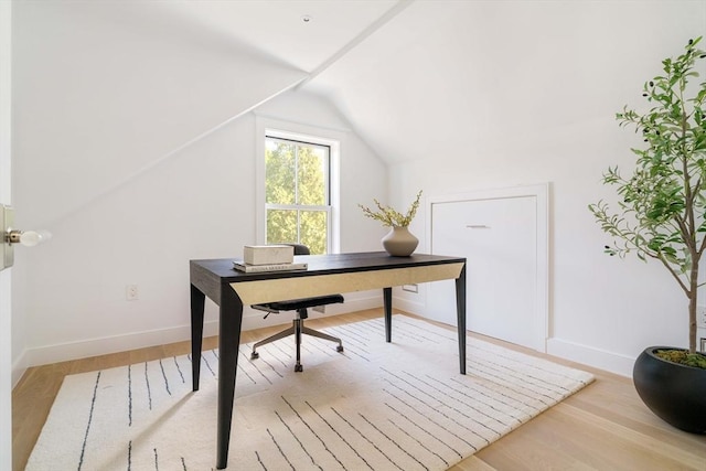 13 Mellen St, Cambridge, MA 02138 - office featuring lofted ceiling, baseboards, and light wood-style flooring