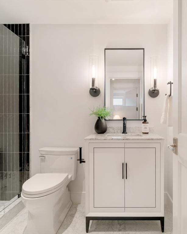 13 Mellen St, Cambridge, MA 02138 - bathroom with vanity, toilet, and a tile shower