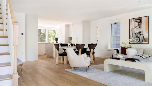 13 Mellen St, Cambridge, MA 02138 - living area featuring stairs and light wood-style flooring