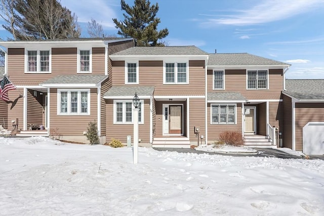 view of front of property featuring a shingled roof and entry steps