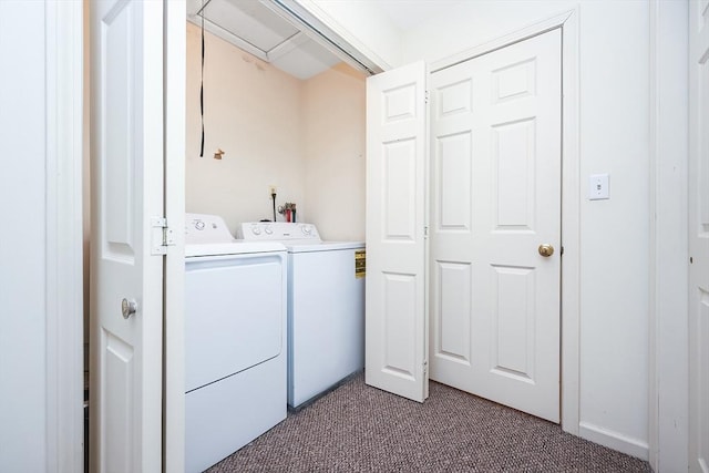 washroom with laundry area, washing machine and clothes dryer, and light colored carpet