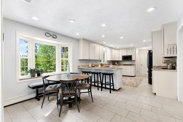 51 Lilah Ln, Reading, MA 01867 - dining room with healthy amount of natural light, recessed lighting, a baseboard radiator, baseboards, and light tile patterned floors