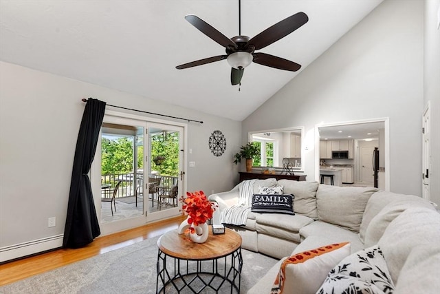 51 Lilah Ln, Reading, MA 01867 - living room featuring light wood-type flooring, a baseboard radiator, high vaulted ceiling, and a ceiling fan