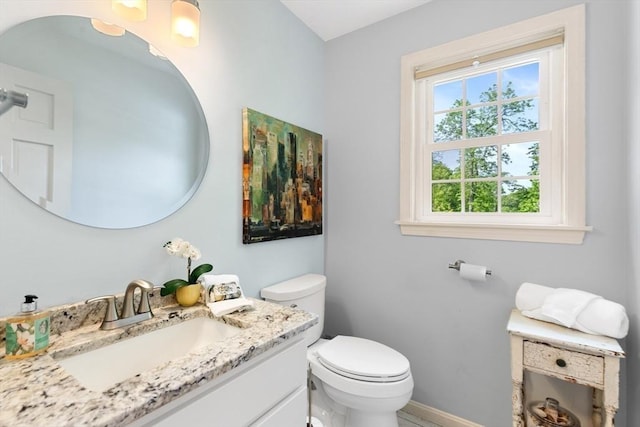51 Lilah Ln, Reading, MA 01867 - bathroom featuring toilet, vanity, and baseboards