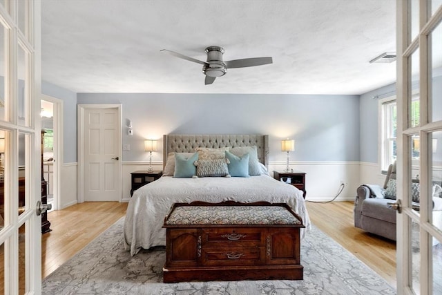 51 Lilah Ln, Reading, MA 01867 - bedroom with wood finished floors, a wainscoted wall, and a ceiling fan