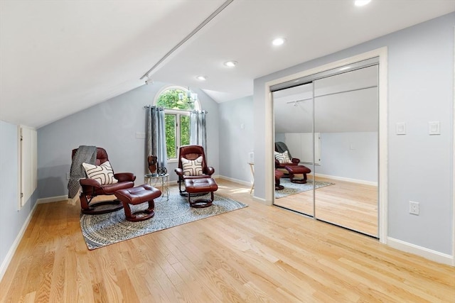 51 Lilah Ln, Reading, MA 01867 - living area with wood finished floors, lofted ceiling, and baseboards