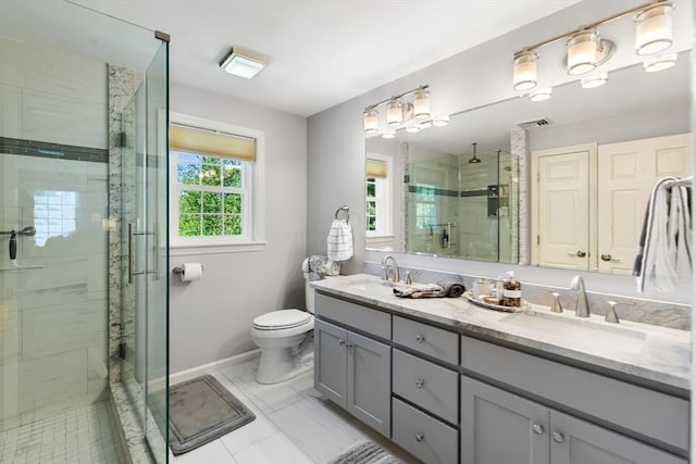 51 Lilah Ln, Reading, MA 01867 - bathroom with a stall shower, double vanity, baseboards, and toilet